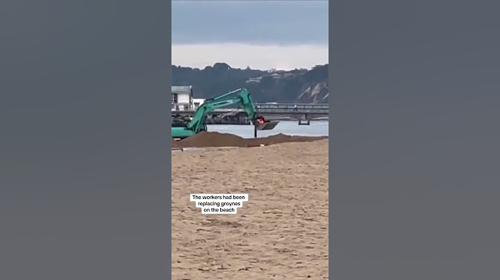 Bournemouth: Driver stuck in sea rescued by colleague's digger