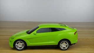 Plastic green colored toy car slowly moving on a wooden table ... | Indian Stock Footage | Knot9 screenshot 4