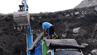 Heavy equipment working: Excavator loading trucks on under high cliff | Daily Mining Movie