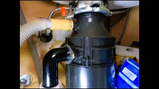 Installing a Garbage disposal and water shutoff valve.