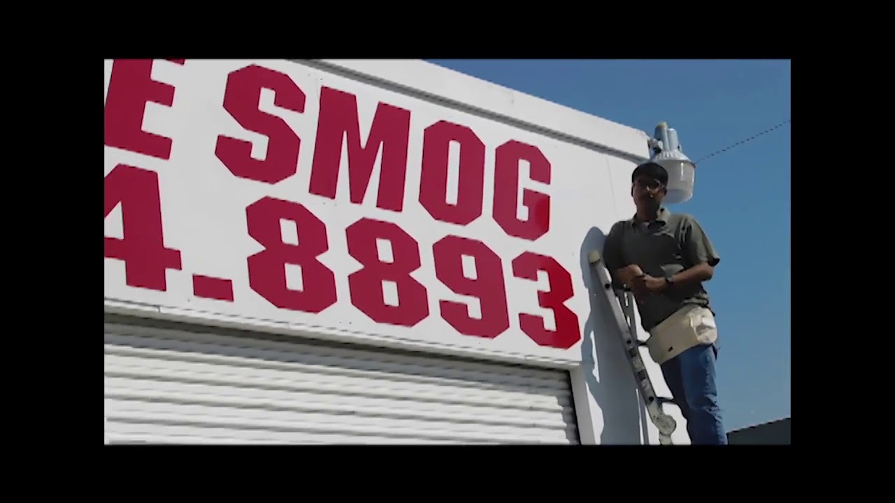 Fresno's Kool Design installs "Cal State Smog Shop" Sign
