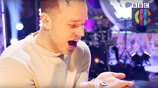 Olly Murs reacts to getting his Blue Peter Badge | CBBC