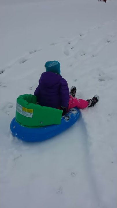 Ava on her sled