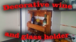 This is how we made this decorative wall mounted wine bottle and glass holder, it ended up looking kind of rustic but it still looks 