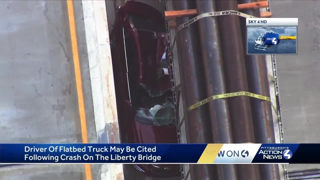 Tractor-trailer pins car against Jersey barrier on Liberty Bridge in Pittsburgh