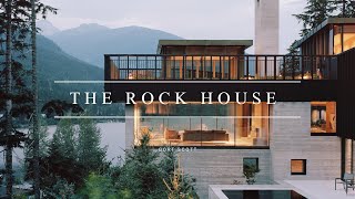 Concrete Home Design On A Rocky Outcrop In The Mountains Facing The Lake