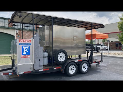 The Q Mobile Smoker at Food City Kingsport Tennessee smoking meats