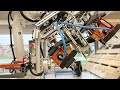 Robot drills hole in pallet