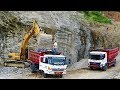 Excavator Loading Rock Into Dump Truck After Blasting