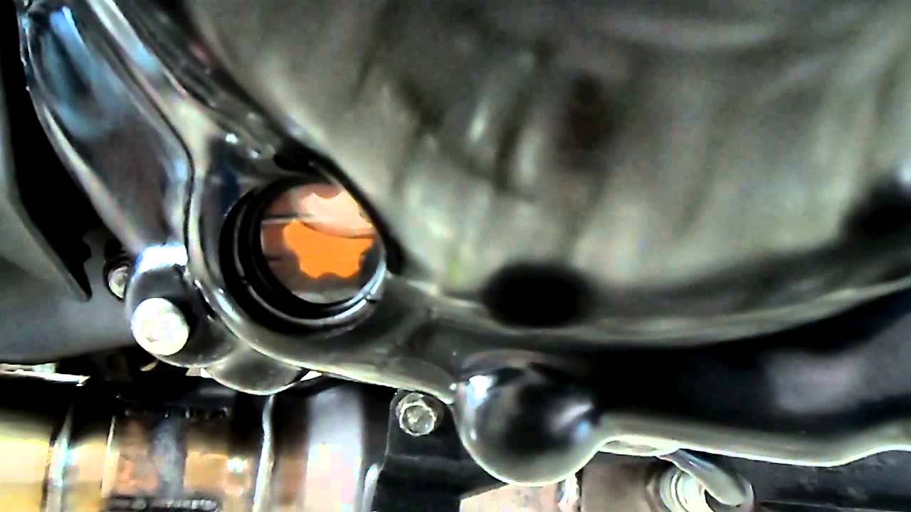 How do you change the oil in a motorcycle?