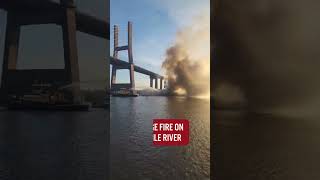 Heavy smoke could be seen from a barge in the Mobile River near the Cochrane-Africatown Bridge.