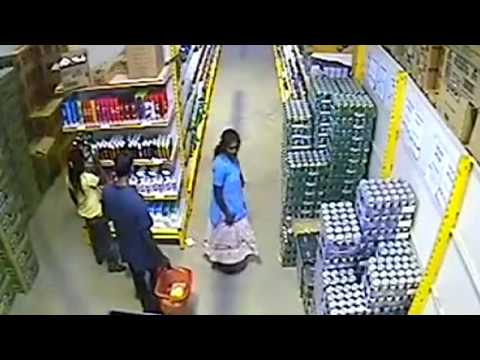 Woman steals beer under her skirt