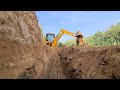 jcb digging drain for watering the paddy field || jcb at work || jcb working video || jcb working