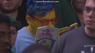 bucks fan reading comic book during game