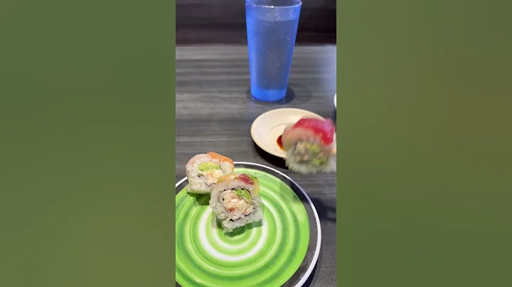 Grab sushi  from a rolling belt! Waiters are robot...