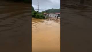 Truck Drivers Help People Cross Deep Water