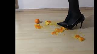 Heels crush orange | Heels trample orange | Crushing with black shiny heels