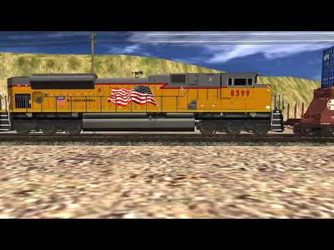UP 8420 leads a westbound 4x5x2 z train charging through Daddyton,ID with a SP dash 9 as the mid DPU