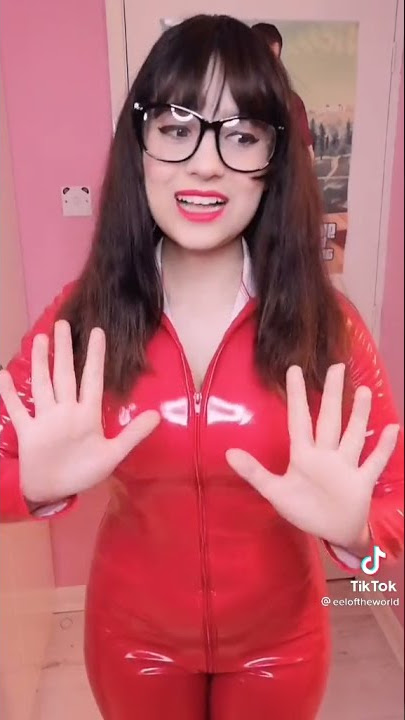 Girl wearing a red latex catsuit ✨