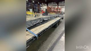 Hotshot Trucking Tarping a Steel  flatbed load