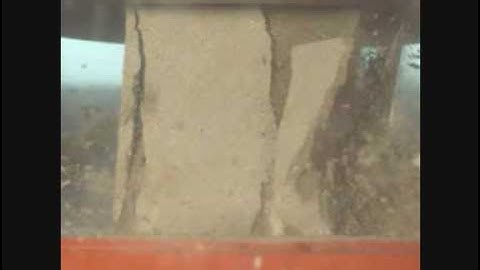 Explosion of concrete cube in slow motion