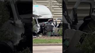 Crews work after two 18-wheelers crash on I-10, leaving one dangling off the freeway.