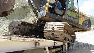 Excavator Volvo EC 210 B Mobilization With Self Isuzu Truck Loader