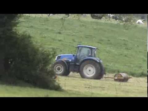 New Holland Tractor Rolling Grass by A48