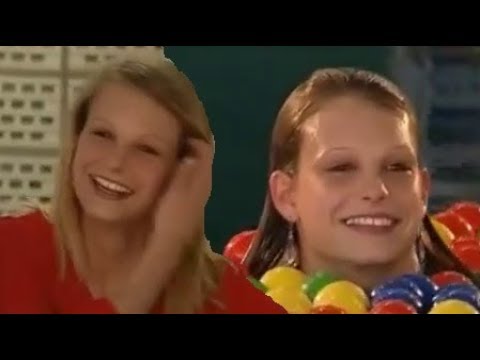 Cute German girls take an unexpected dip in the swimming pool