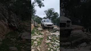 Lada niva between a rock and a hard place