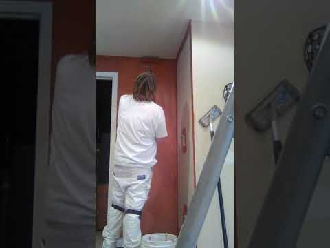 Rolling an accent color red walls with a 9 inch roller