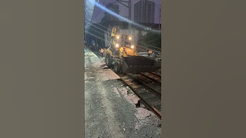 JCB on railway track.