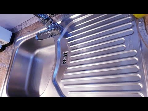 Video: Si të pastroni shpejt një lavaman guri artificial në kuzhinë