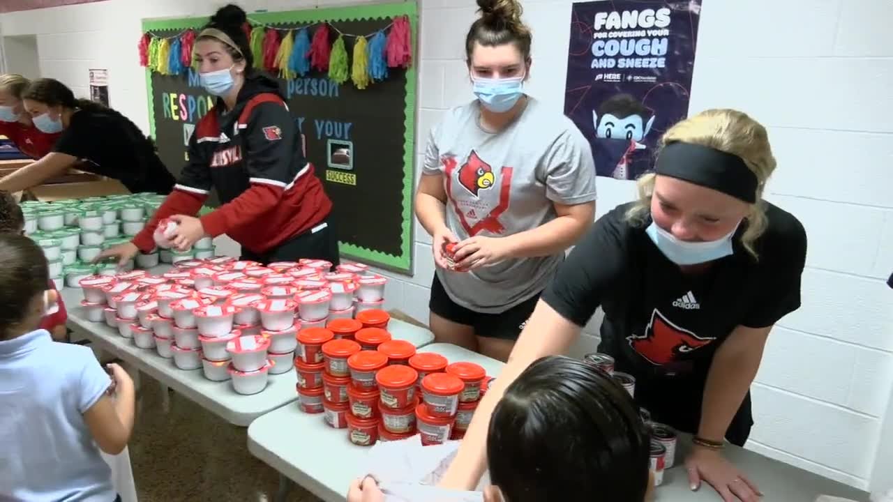 Blessings in a Backpack volunteers hand out muchneeded meals to