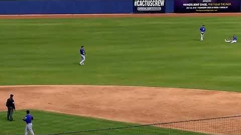 Ian Happ making a diving catch and stranding the bases loaded