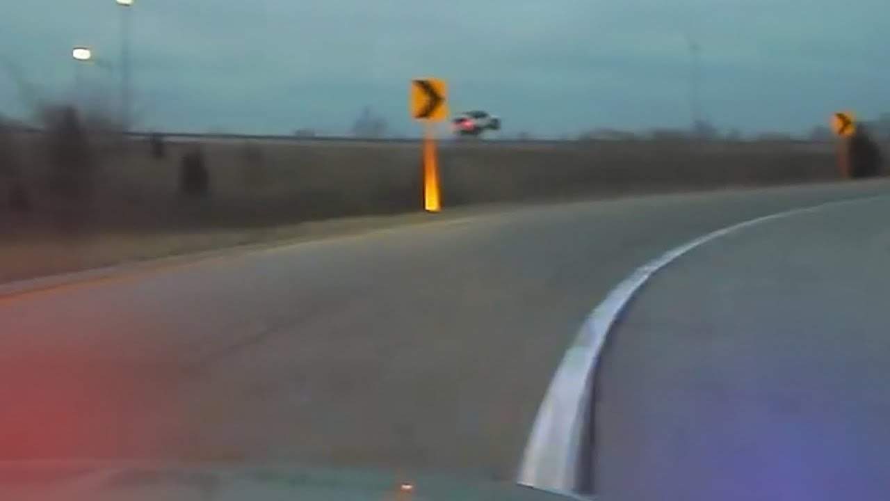 Distracted Driver Jumps over Guard Rail! - YouTube