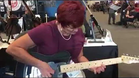 Paula Jo Taylor "Viral Granny Guitarist" playing a...