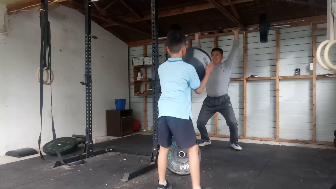 50 medicine ball clean 25 push jerk (70kg) 50 medicine ball clean YouTube
