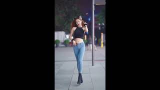 The Catwoman In Tight T-Shirt And Jeans