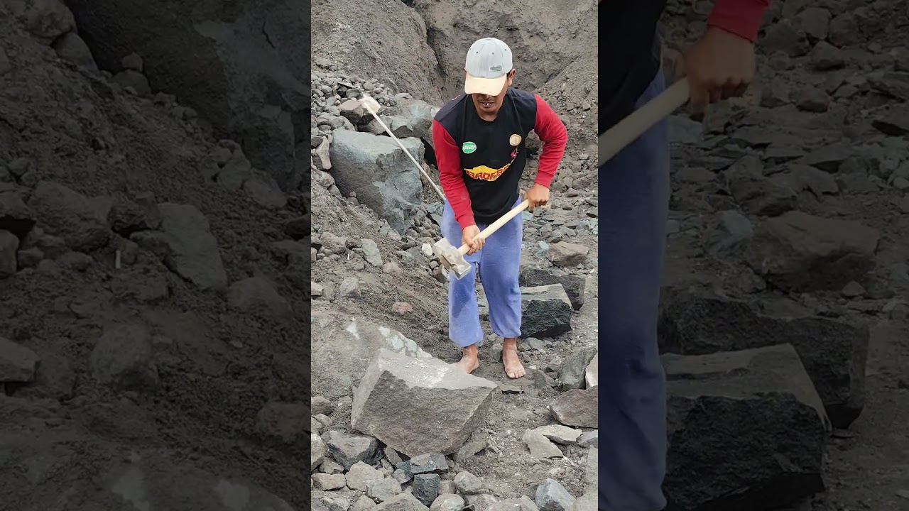 working hard to break stones