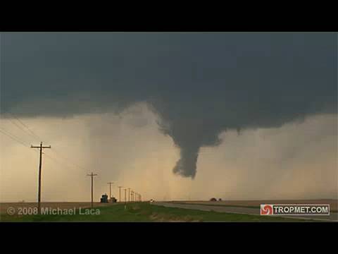 Storm chasers Michael Laca, Jim Leonard, Linda Kitchen, Kathy Velasquez, Ray Walker, Eric Baker and Max Hagen intercepted an intensifying supercell thunderstorm in Gove County, Kansas on the afternoon of May 22, 2008. This particular cell produced a well-defined rotating wall cloud, with very low rotating scud, that evolved into a ragged funnel as it crossed the road in front of us. From our observations the circulation did not appear to have any reflection on the surface. So, although impressive in appearance, this likely wasn't a tornado.