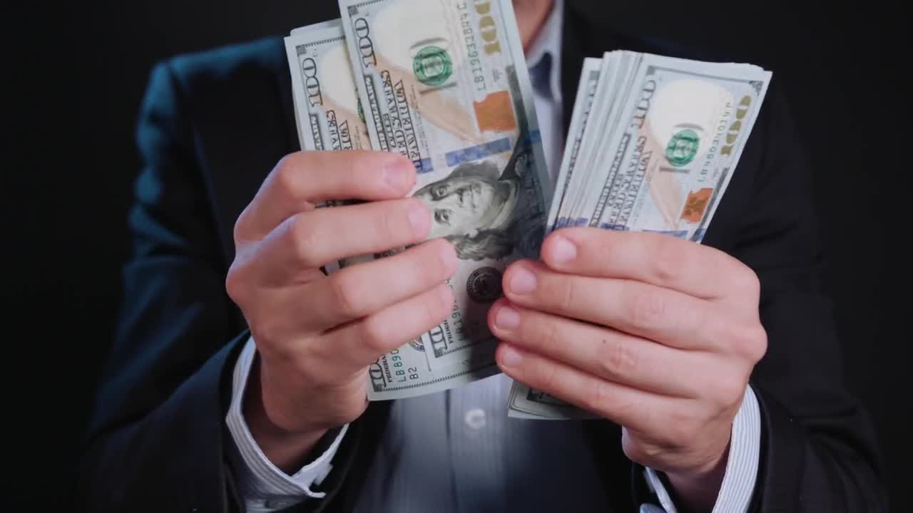 Man Counting Hundreds Dollars Stock Video