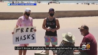 Two rs went to huntington beach hand out free masks beachgoers during
the coronavirus pandemic. stacey butler.