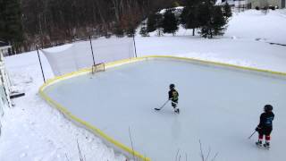 Hunter and Nate 1-2-2013 on backyard rink NiceRink