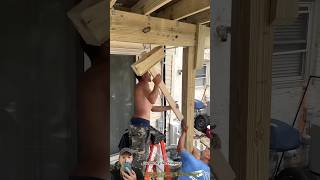 Manual Column Installation: How Workers Secure Structural Posts with a Wooden Mallet Manual Column Installation: How Workers Secure Structural Posts with a Wooden Mallet