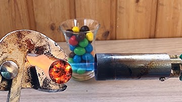 Experiment Glowing 1000 Degree Metal Ball VS M&M