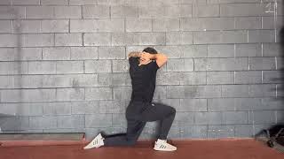 Wall Split Stance Rotation (Prisoner)