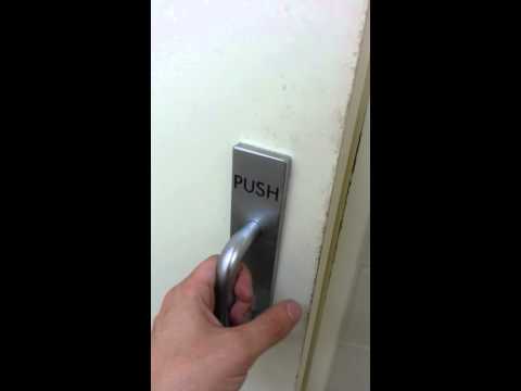 Pulling a door that says 'Push'