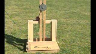 This is a floating arm trebuchet with a three foot throwing arm and 10 lb counterweight firing a 2oz projectile. Its range is roughly 130 