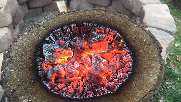 Kettle boiling over an open flame while camping, Atlin, British